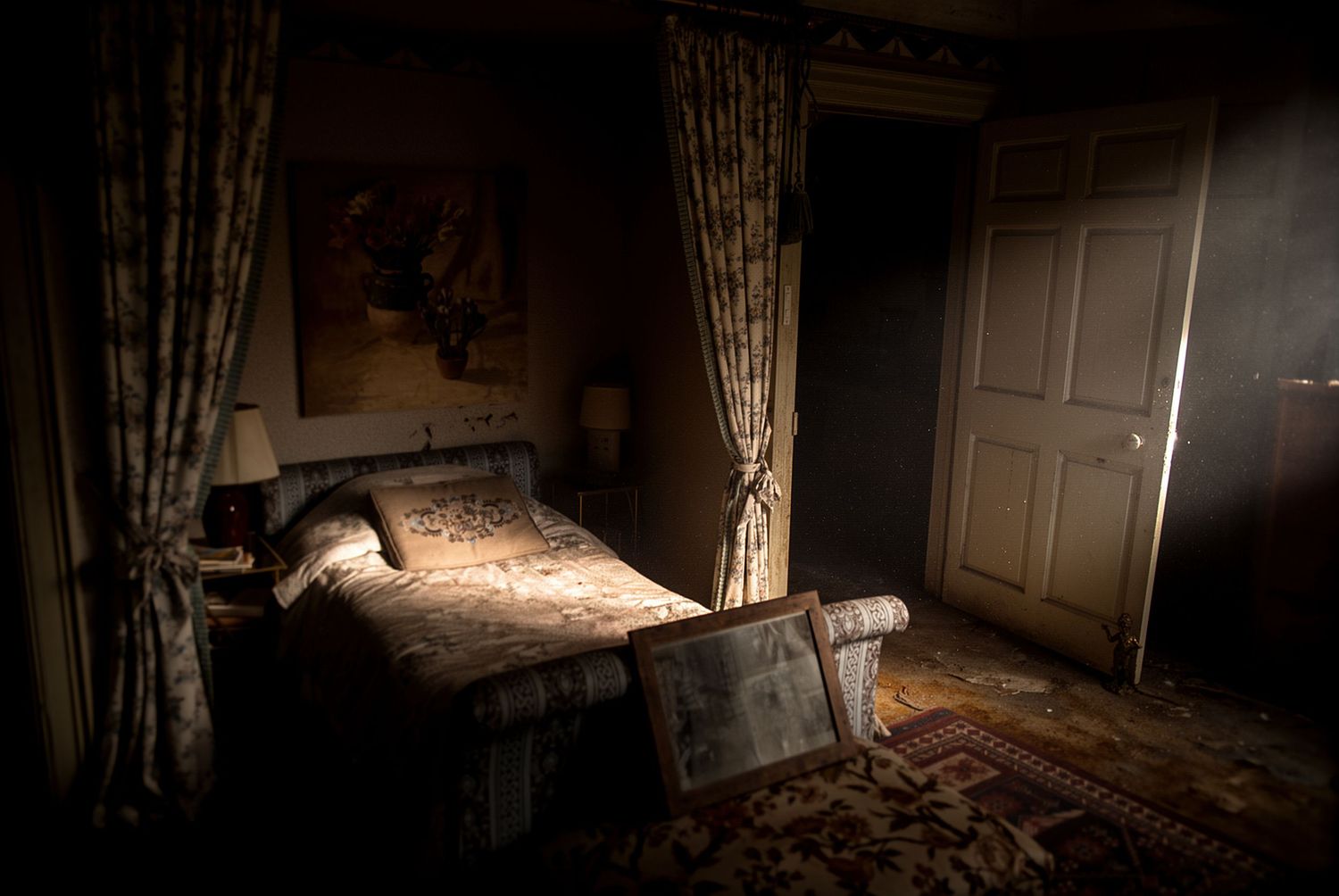 Dark moody bedroom with ornate curtains, antique bed frame, and dim lamp creating an eerie, gothic atmosphere.